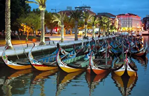 TRADITIONAL BOATS STAND ON ONE OF THE AVEIRO CITY CANALS TRADITIONAL BOATS STAND ON ONE OF THE AVEIRO CITY CANALS