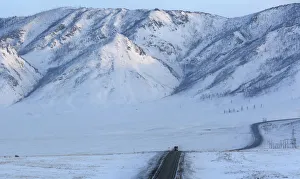A truck drives along the R257 federal highway in the Republic of Tuva A truck drives along the R257 federal highway in the Republic of Tuva