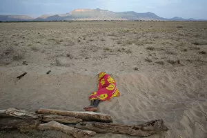 Related Images Collection: A Turkana man sleeps on the western shore of Lake Turkana close to Todonyang near the
