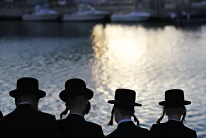 Ultra-Orthodox Jewish men perform the Tashlich ritual on the shore of the Mediterranean Ultra-Orthodox Jewish men perform the Tashlich ritual on the shore of the Mediterranean