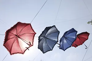 Umbrellas decorate a main shopping district in Beiruts suburbs as part of a shopping Umbrellas decorate a main shopping district in Beiruts suburbs as part of a shopping