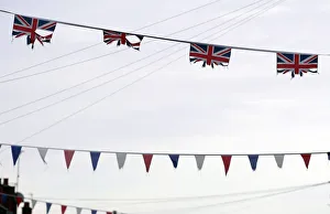 Union flags and coloured bunting hang above a street in South Belfast Union flags and coloured bunting hang above a street in South Belfast