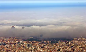 An unusual fog settles over Barcelonas city coastline An unusual fog settles over Barcelonas city coastline