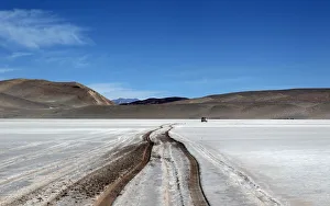 Vehicle tracks are seen on the surface of the salt flat at Olaroz Vehicle tracks are seen on the surface of the salt flat at Olaroz