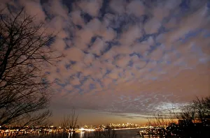A view of storm clouds above New York City and the Hudson River at sunset A view of storm clouds above New York City and the Hudson River at sunset