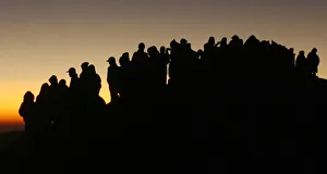 Villagers stand near a volcanic crater during a ritual to mark the Kasada festival Villagers stand near a volcanic crater during a ritual to mark the Kasada festival