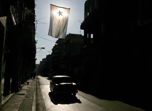 A vintage Chevrolet is driven down a street in Old Havana A vintage Chevrolet is driven down a street in Old Havana