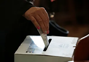 A voter casts her ballot during the presidential election at a polling station in San A voter casts her ballot during the presidential election at a polling station in San