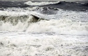 Waves break along Frances Atlantic coastline at sunset in Lacanau Waves break along Frances Atlantic coastline at sunset in Lacanau