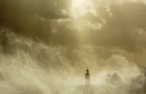 Waves crash against a lighthouse at Newhaven on the Sussex coast in southern England Waves crash against a lighthouse at Newhaven on the Sussex coast in southern England