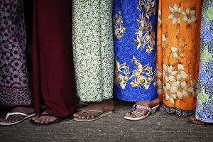 Women wait in line to see the sacred Buddhas tooth relic on display at a temple in Women wait in line to see the sacred Buddhas tooth relic on display at a temple in