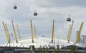 Workers sit in gondolas as they perform tests on the new cable car link across the Workers sit in gondolas as they perform tests on the new cable car link across the