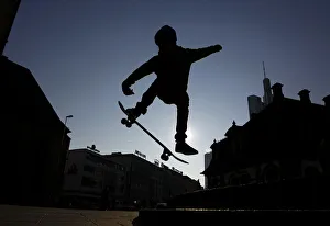 A young skateboarder performs a jump near the Hauptwache during a freezing cold A young skateboarder performs a jump near the Hauptwache during a freezing cold