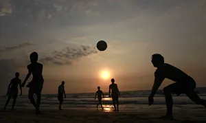 Youths play volleyball on the beach in Colombo Youths play volleyball on the beach in Colombo