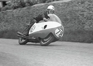 Bob McIntyre (Gilera) setting the first Ton lap of the TT Bob McIntyre (Gilera) setting the first Ton lap of the TT