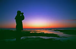 Birdwatching at dawn, Snettisham RSPB Reserve, Norfolk, UK Birdwatching at dawn, Snettisham RSPB Reserve, Norfolk, UK