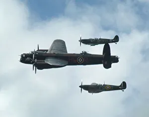2011 Goodwood Revival Lancaster bomber and 2 Spitfires in aerial display 2011 Goodwood Revival Lancaster bomber and 2 Spitfires in aerial display