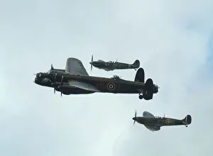 Lancaster Bomber with 2 Spitfire Fighter planes, 2011 Goodwood revival Lancaster Bomber with 2 Spitfire Fighter planes, 2011 Goodwood revival