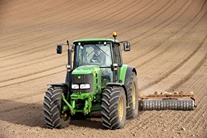 Prints of John Deere tractor pulling soil press, rolling seedbed in arable field, Kelso, Scottish Borders, Scotland, september Images Dated: John Deere Tractor Pulling Soil Press Print