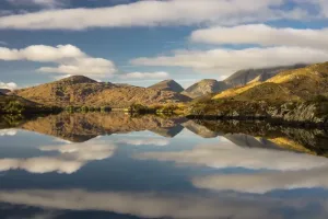 Upper Lake Ireland Prints: View of mountains and clouds reflected in lake