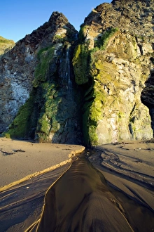 North Yorkshire Waterfalls Prints: Waterfall flowing from cliffs onto sandy beach