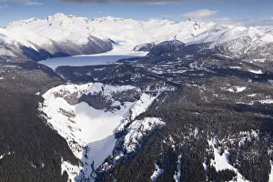 Aerial view of frozen Garibaldi Lake and lava barrier in the foreground Aerial view of frozen Garibaldi Lake and lava barrier in the foreground