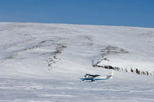 airplane dropping off supplies on Herschel Island, off the Mackenzie River delta airplane dropping off supplies on Herschel Island, off the Mackenzie River delta