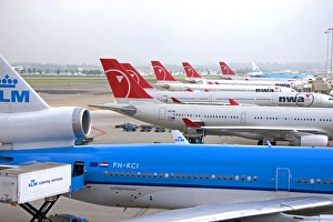 Airplanes parked at Schiphol Airport in Amsterdam, Netherlands Airplanes parked at Schiphol Airport in Amsterdam, Netherlands