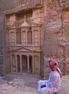 Al Khazneh Collection: Arab man watching Facade of Treasury (Al Khazneh), Petra, Jordan (UNESCO World Heritage