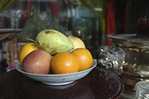 Asia, Vietnam. Fresh fruit in a bowl, Quan Congs Temple, Hoi An, Quang Nam Province Asia, Vietnam. Fresh fruit in a bowl, Quan Congs Temple, Hoi An, Quang Nam Province