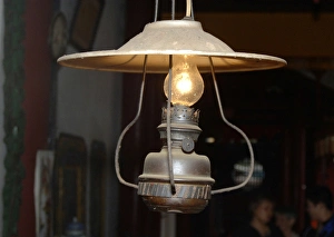Asia, Vietnam. Old kerosene lamp converted to electricity, Quan Congs Temple Asia, Vietnam. Old kerosene lamp converted to electricity, Quan Congs Temple