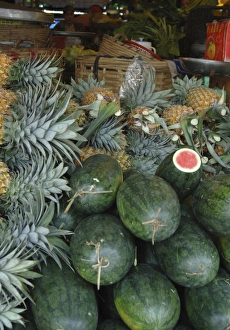 Asia, Vietnam. Watermelons and pineapples for sale at a local market, Can Tho Asia, Vietnam. Watermelons and pineapples for sale at a local market, Can Tho