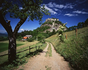 Austria, Tyrol, Reutte, View of dirt road through field Austria, Tyrol, Reutte, View of dirt road through field