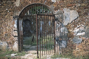 Barred Iron Gate to Prison Complex; Ile Royale; DevilaAAs Islands, French Guiana Barred Iron Gate to Prison Complex; Ile Royale; DevilaAAs Islands, French Guiana