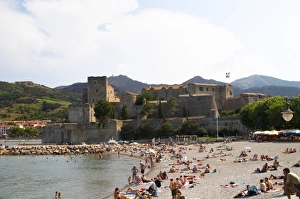 The beach in the village. The chateau in Collioure harbour. Collioure. Roussillon The beach in the village. The chateau in Collioure harbour. Collioure. Roussillon