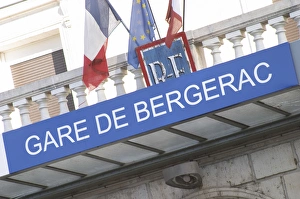 The Bergerac train station. Detail of the sign and the French flags. Bergerac Dordogne The Bergerac train station. Detail of the sign and the French flags. Bergerac Dordogne