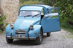 A blue old Citroen 2CV 2 CV converted into a transport van. Moulin Mas des Barres olive mill A blue old Citroen 2CV 2 CV converted into a transport van. Moulin Mas des Barres olive mill