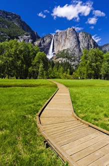 Boardwalk through meadow under Yosemite Falls, Yosemite National Park, California USA Boardwalk through meadow under Yosemite Falls, Yosemite National Park, California USA
