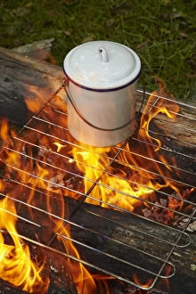 Boiling water in a billy on a campfire, Central Otago, South Island, New Zealand Boiling water in a billy on a campfire, Central Otago, South Island, New Zealand