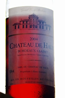 A bottle of Chateau de Haux rose clairet wine backlit Chateau de Haux Premieres A bottle of Chateau de Haux rose clairet wine backlit Chateau de Haux Premieres