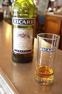 A bottle of Ricard 45 pastis and a glass on a zinc bar in a cafe bar in Paris Pastis A bottle of Ricard 45 pastis and a glass on a zinc bar in a cafe bar in Paris Pastis