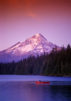 Two boys in canoe just after sunset at Lost Lake with Mt. Hood in the background Two boys in canoe just after sunset at Lost Lake with Mt. Hood in the background