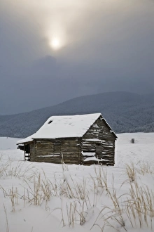Bozeman, MT. An old barn sits quietly in a field amongst the freshly fallen snow Bozeman, MT. An old barn sits quietly in a field amongst the freshly fallen snow