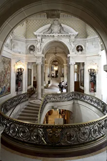 The brass railing decorated staircase in Chateau de Chantilly. Chantilly. France The brass railing decorated staircase in Chateau de Chantilly. Chantilly. France