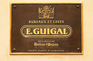 The brass sign at the entrance saying Bureaux et Caves E Guigal Siege Social au Chateau The brass sign at the entrance saying Bureaux et Caves E Guigal Siege Social au Chateau