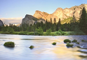 Bridalveil Falls behind Merced River. Yosemite, California, US Bridalveil Falls behind Merced River. Yosemite, California, US