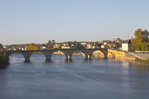 The bridge acrosse the river Dordogne and the Old Town of Bergerac in morning sunshine The bridge acrosse the river Dordogne and the Old Town of Bergerac in morning sunshine