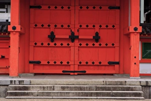 A bright red door in the grounds of the Sanjuusangendo Temple in Kyoto, Japan A bright red door in the grounds of the Sanjuusangendo Temple in Kyoto, Japan