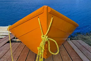 Canada, Newfoundland, Frenchman Cove. Orange boat on dock Canada, Newfoundland, Frenchman Cove. Orange boat on dock