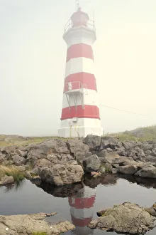 Canada, Nova Scotia, Brier Island. Reflection of Brier Island Lighthouse in pond Canada, Nova Scotia, Brier Island. Reflection of Brier Island Lighthouse in pond